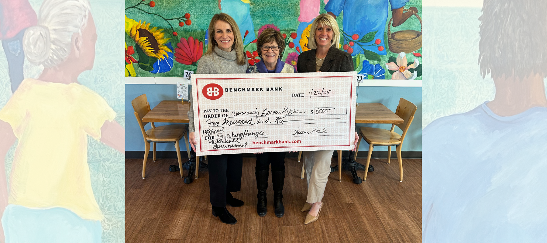 Kelly Buettner and Laurie Pool of Benchmark Bank & Title present a $5,000 check to Angela Poen, founder of Community Garden Kitchen, to kick off the Smashing Hunger Pickleball Tournament.