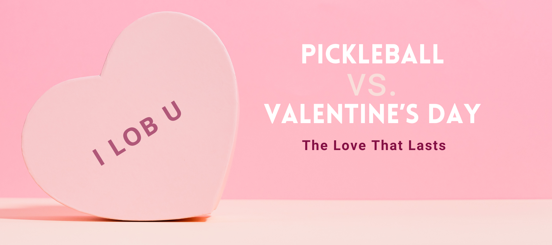 A pastel pink heart-shaped candy box with the phrase "I LOB U" written in bold letters, referencing a pickleball lob shot. To the right, text reads "PICKLEBALL VS. VALENTINE’S DAY - The Love That Lasts" against a pink background.